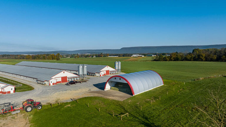 arial shot of thundura fabric structure beside 2 chicken houses