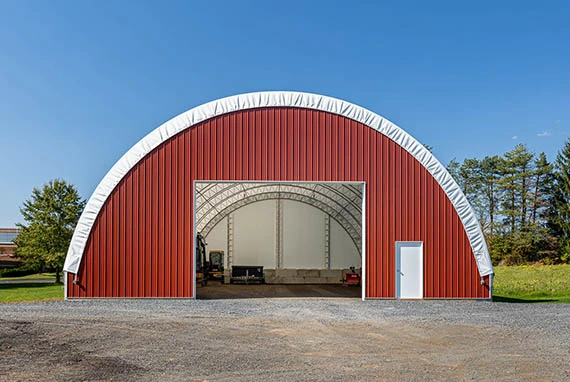 Thundura Hoop building with Tin end wall and large Doorway for equipment entry